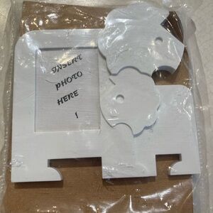Tupperware nuzzles Lion magnetic picture frame. New in pkg